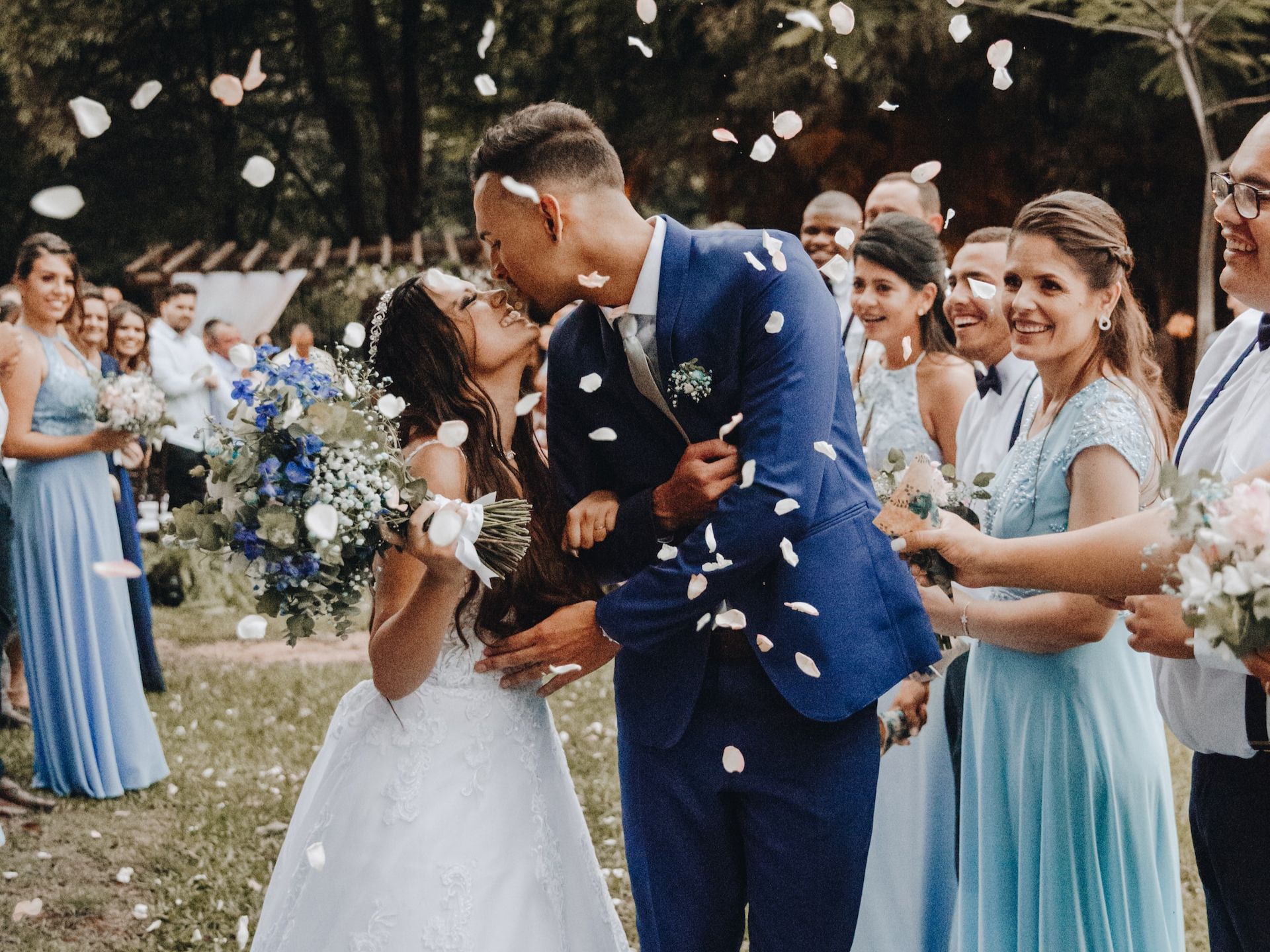 A bride and groom kissing at their wedding.