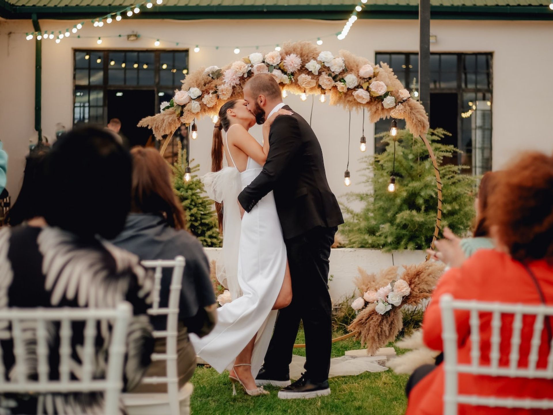 A bride and groom kissing.