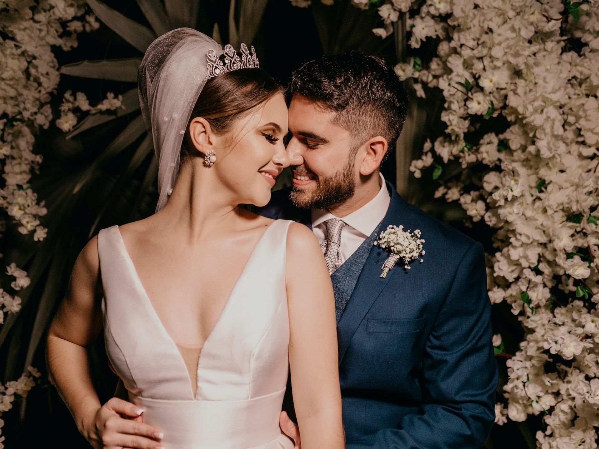 A bride and groom kissing.