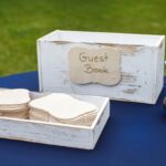 A wedding table with a guestbook on top.