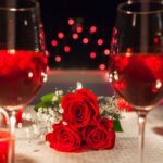A table with red wine and text fun date ideas for year round.