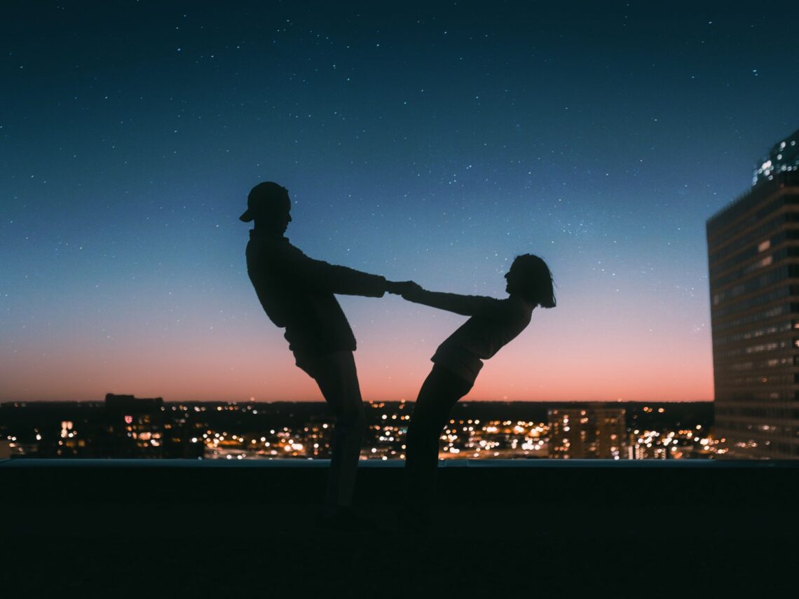 A couple dancing in the dark.