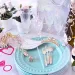 A table filled with bachelorette party decor and favors.