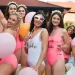 A bride and her bridesmaids having a bachelorette pool party.