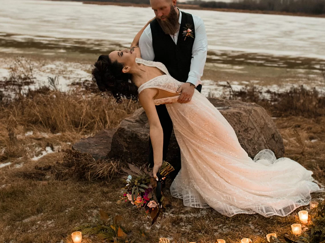A bride and groom at an outdoor fall wedding.
