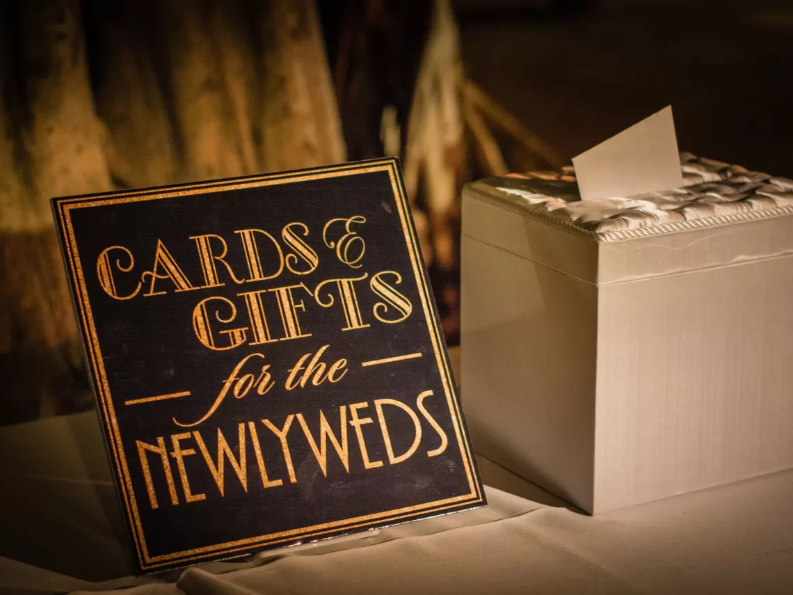 A table with card and wedding gifts.