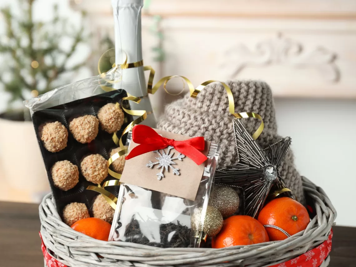 A table topped with a christmas gift box.