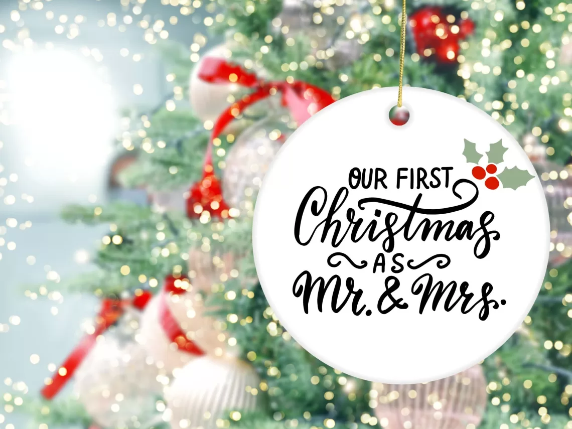 A christmas tree with a Mr & Mrs ornaments.