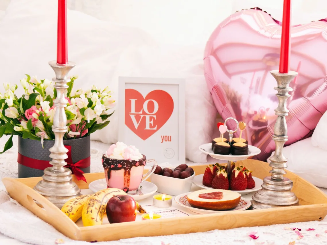 A board with valentine's treats and drinks.