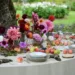A wedding table with bright pink and purple wildflowers.
